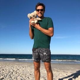 A person holding a teddy bear on a beach

AI-generated content may be incorrect.