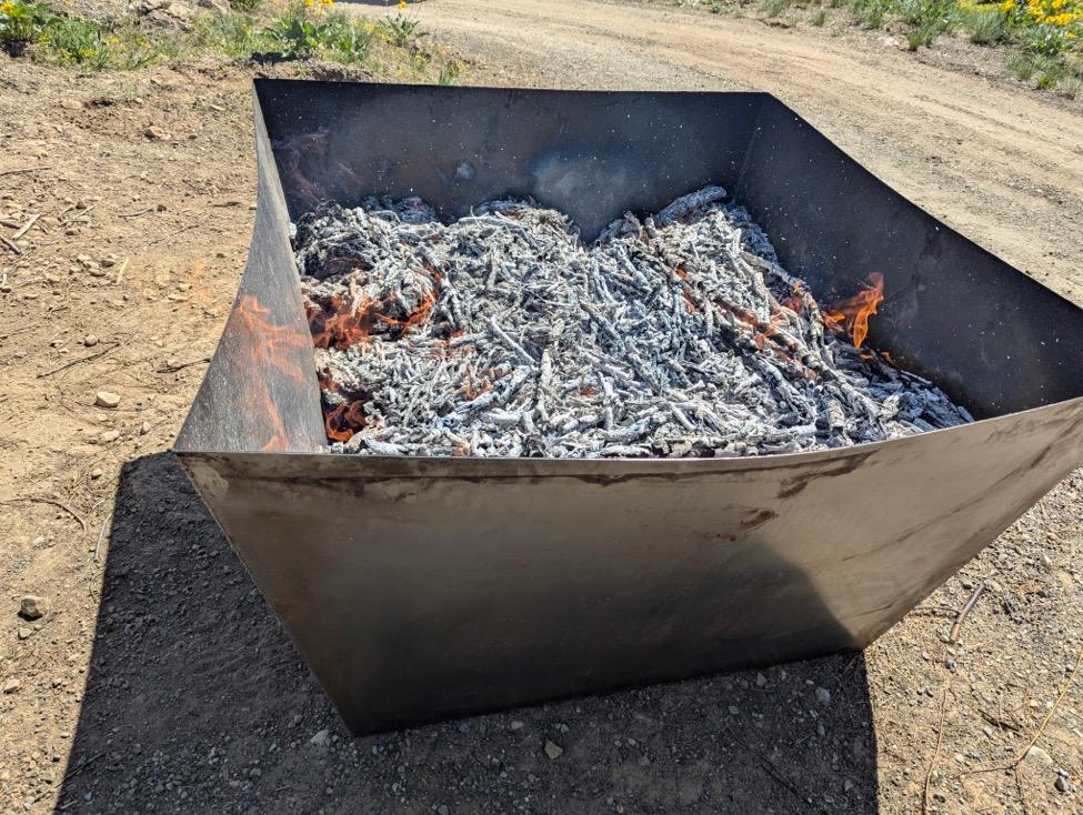 A metal box with fire in it

AI-generated content may be incorrect.