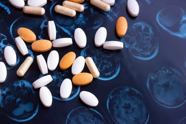 A colorful assortment of brain supplements displayed on a flat surface, emphasizing variety and options for cognitive support.