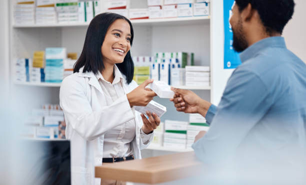 A customer receiving a box of anxiety supplements from a pharmacist at Washington Health & Drug, symbolizing trust and wellness.