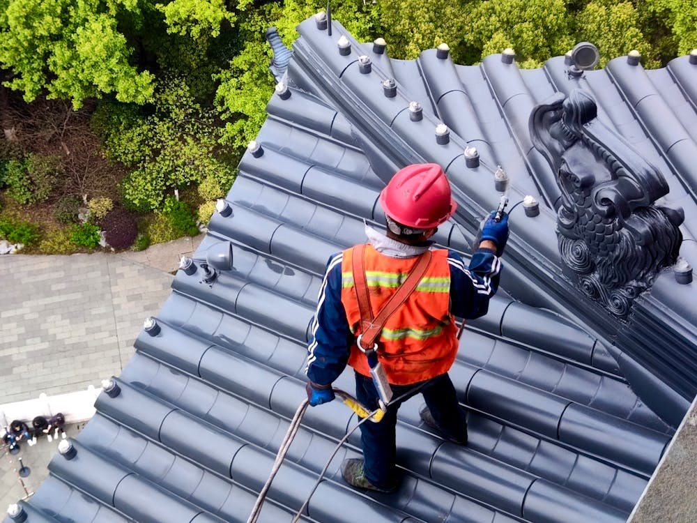 man on top of roof