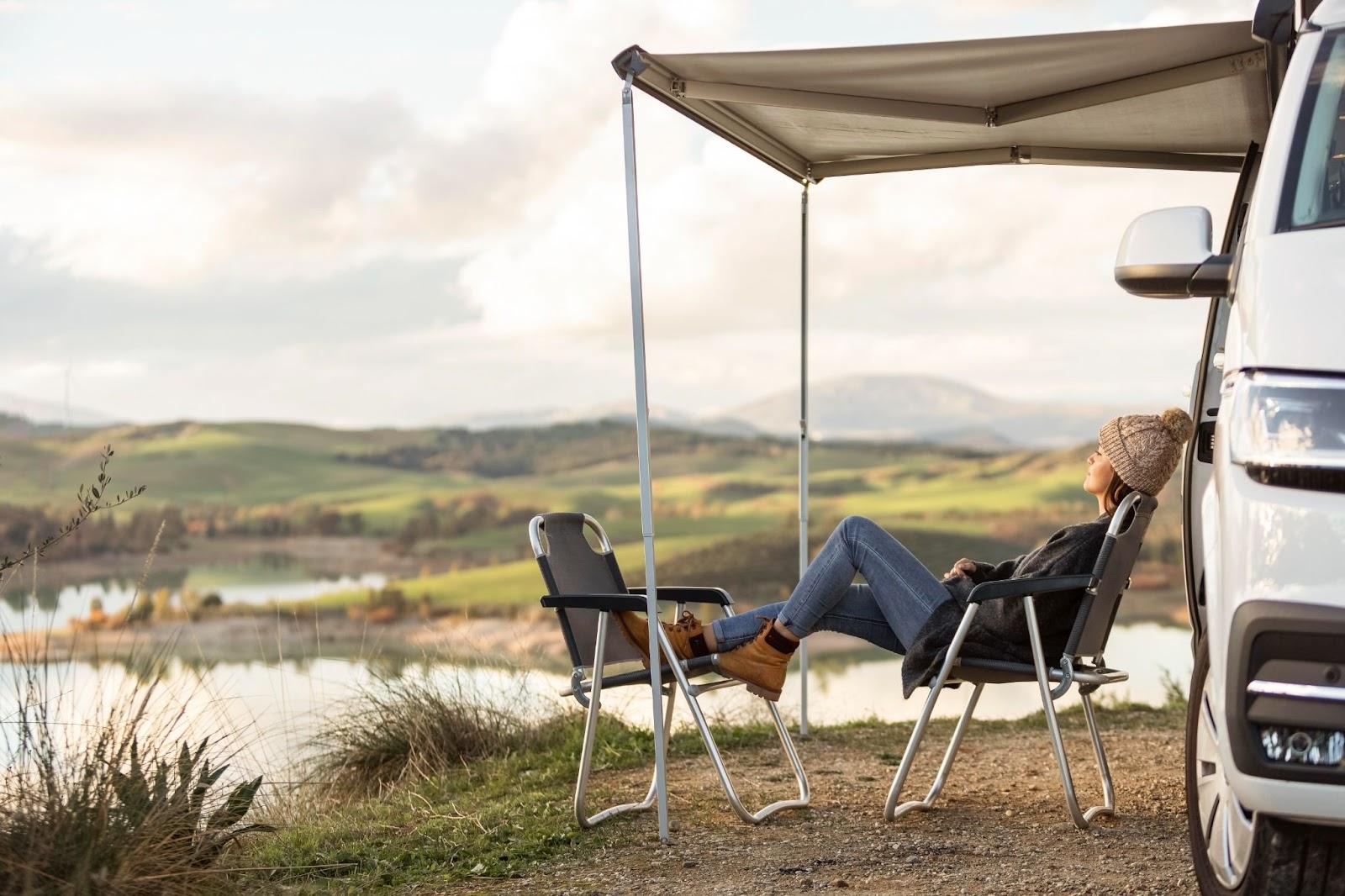 A person sitting in chairs under a canopy

Description automatically generated