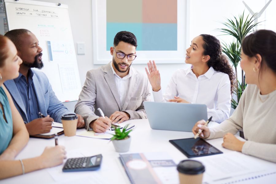 Diverse team in a meeting discussing strategies and ideas