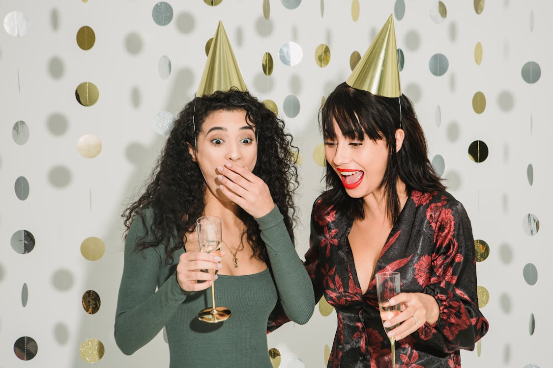 Photo by Julia Larson : https://www.pexels.com/photo/emotional-women-celebrating-holiday-with-champagne-6113210/ 