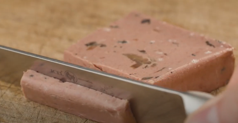 Knife cutting meat