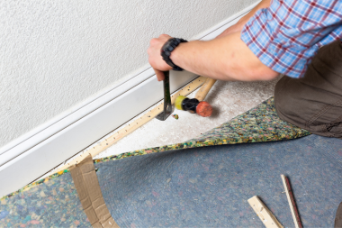 signs that you need a flooring replacement remodeler replacing carpet floor custom built michigan