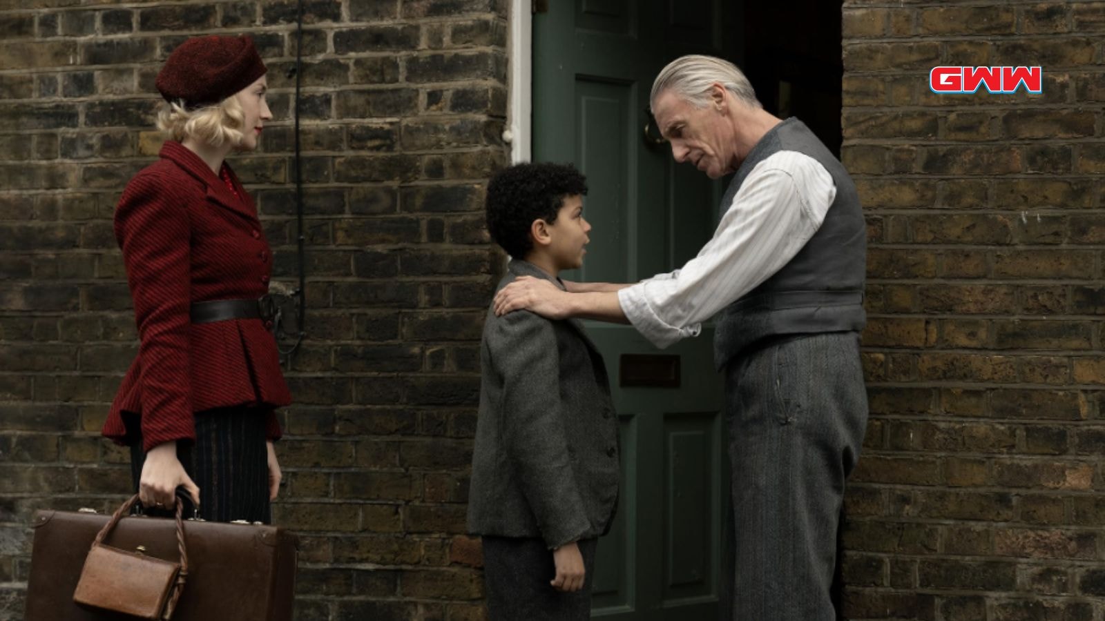 Paul Weller as Gerald, Elliott Heffernan as George, and Saoirse Ronan as Rita in Blitz Movie