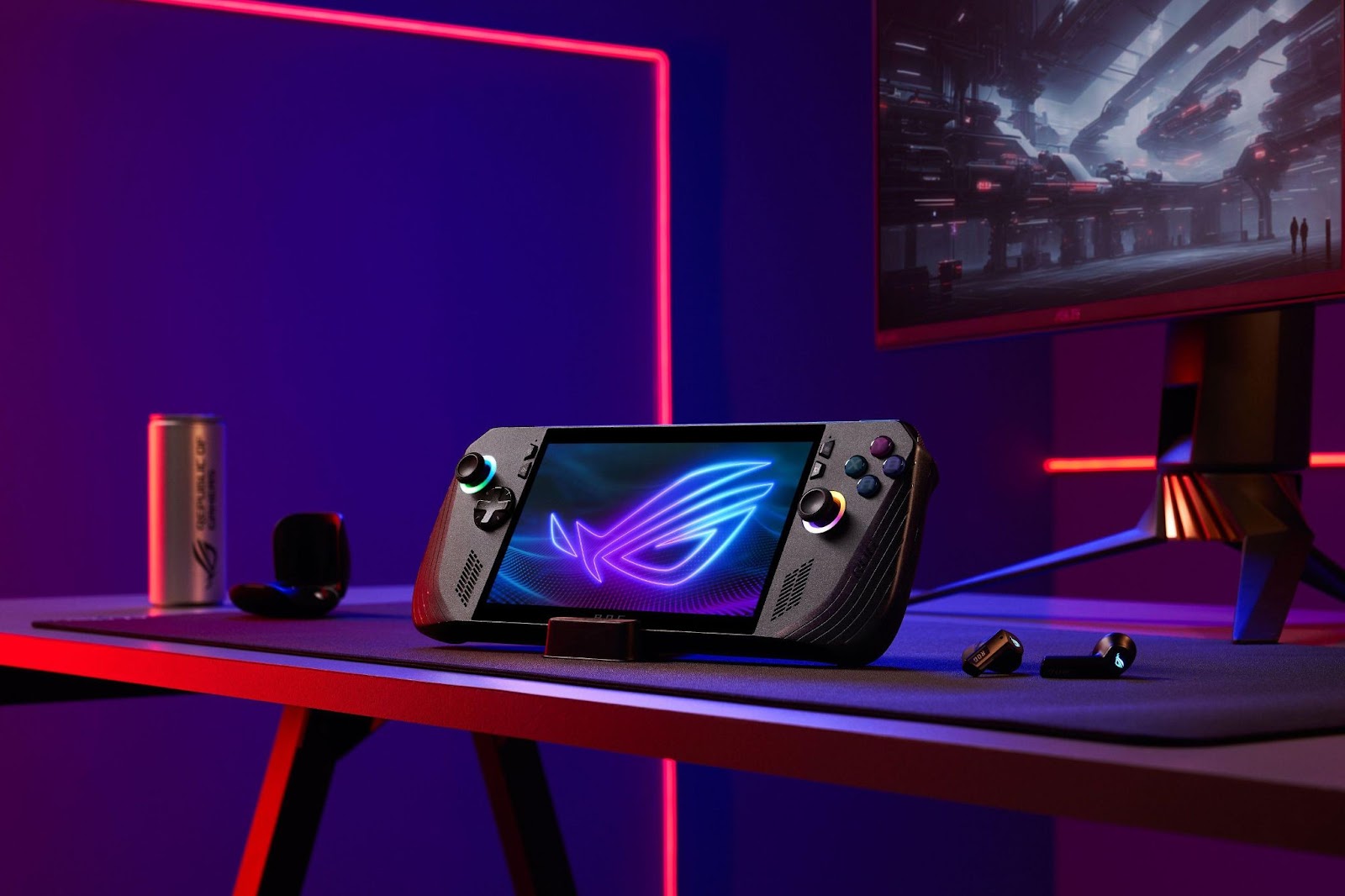 rog ally x em destaque sobre uma mesa gamer iluminada em neon roxo e azul, com monitor ROG ao fundo.
