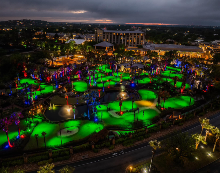 A aerial view of a park with green lightsAI-generated content may be incorrect.