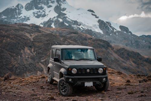 Free A Suzuki Jimny Parked on the Mountain Stock Photo