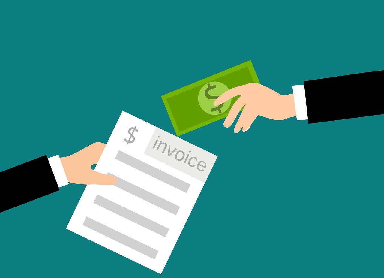 A digital image of one hand giving cash and another hand holding an invoice.