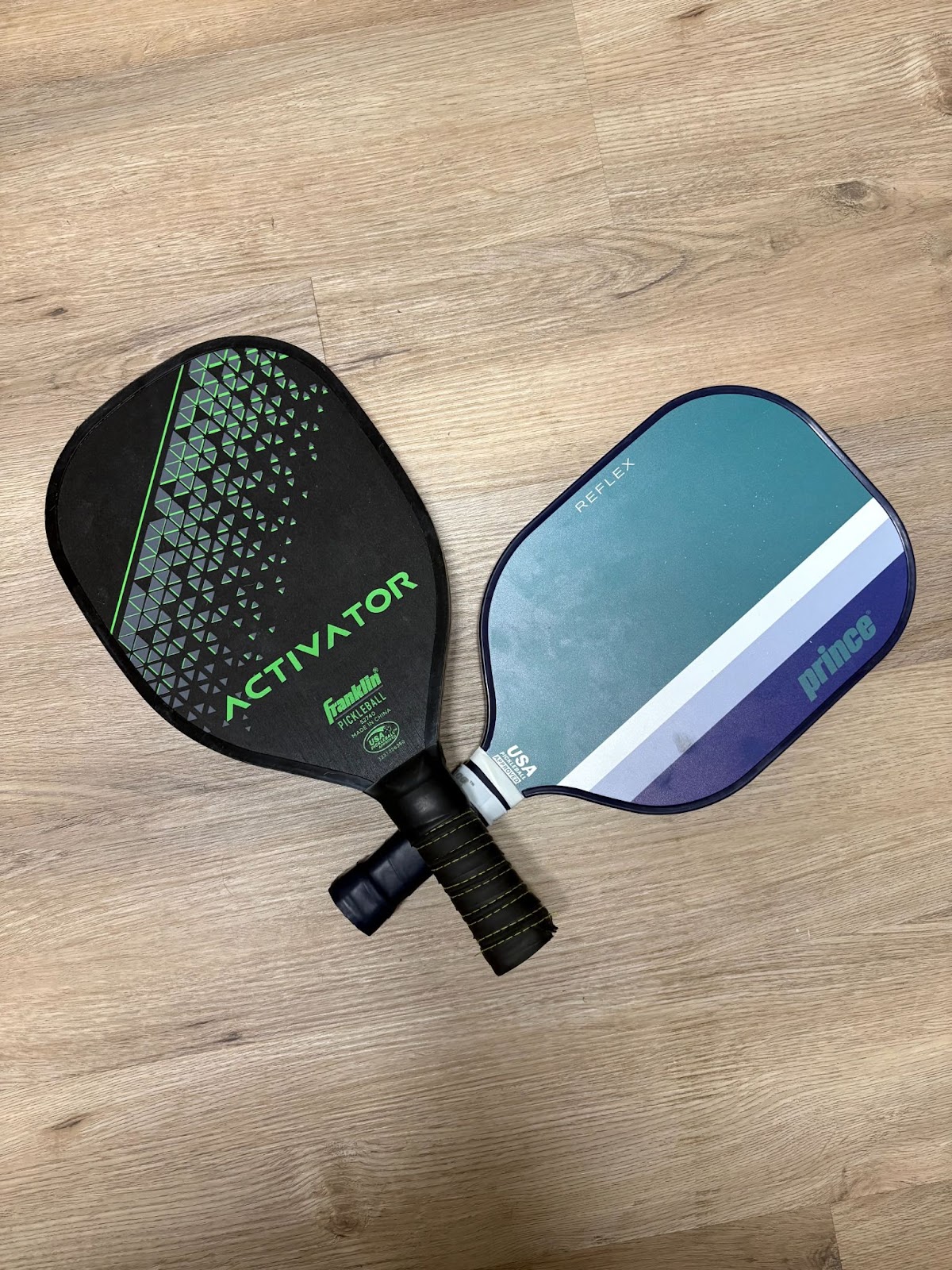 Side by side comparison of wood Franklin Aviator paddle vs Princle pickleball paddle.