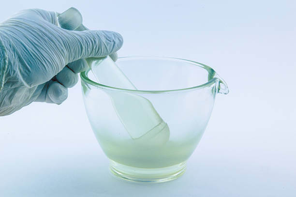 A pharmacist carefully preparing semaglutide in a sterile compounding lab, showcasing precision and attention to detail.