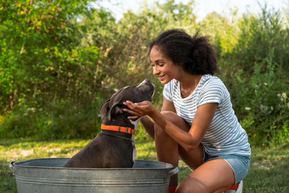 A woman and her dog enjoying time together outdoors