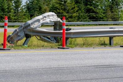 A damaged road with a metal object on the side

AI-generated content may be incorrect.