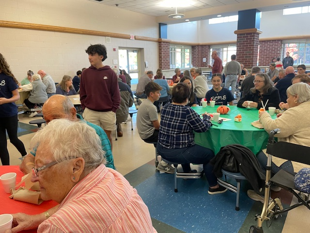 image of students and seniors at the Senior Breakfast.