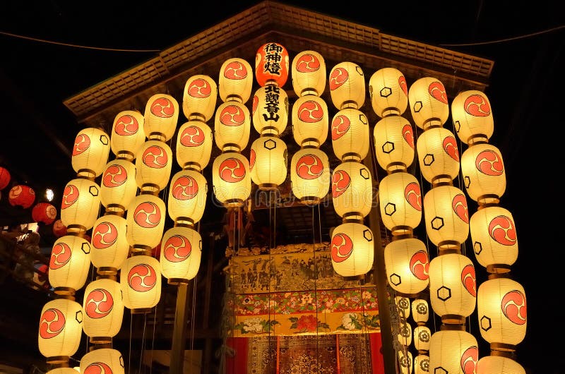 Gion Matsuri festival in Kyoto at night with elaborate yamaboko floats illuminated by traditional paper lanterns creating spectacular photography opportunities