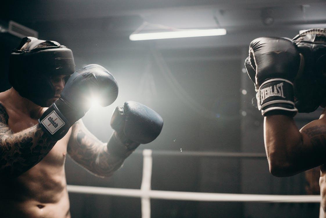 Man in Black Boxing Gloves