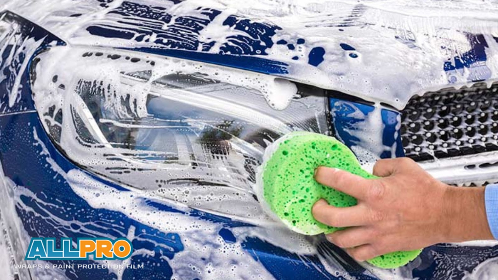 Applying a pH-neutral car shampoo to protect the ceramic coating during the wash process