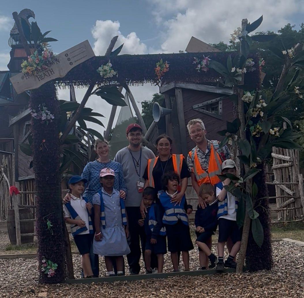 A group of people posing for a photo

Description automatically generated