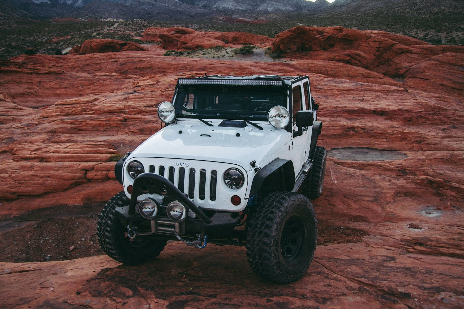 Jeep off-roading on red rocks