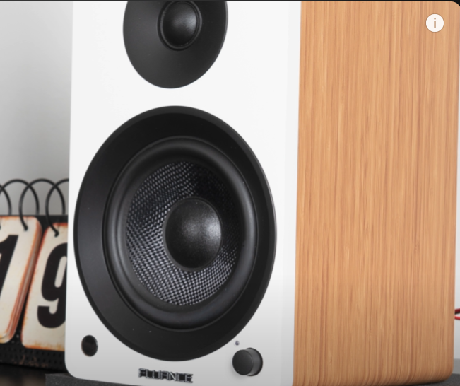 Close-up of a Fluance bookshelf speaker with a black tweeter and woofer. 