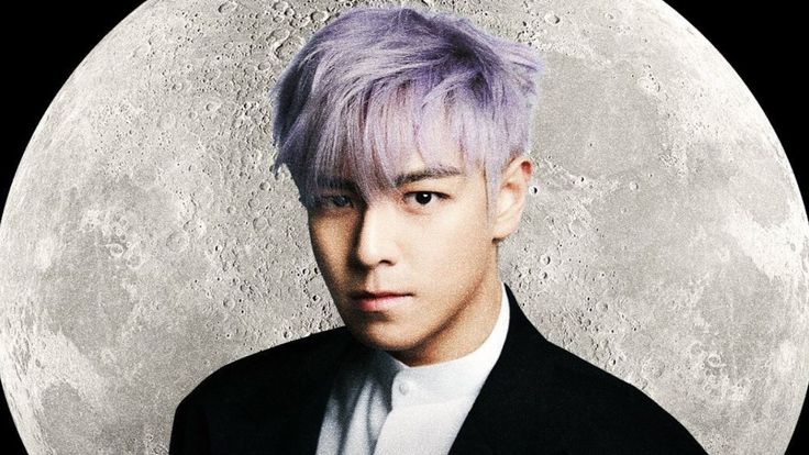 This contains an image of TOP with purple hair wearing a black suit and white shirt in front of a full moon