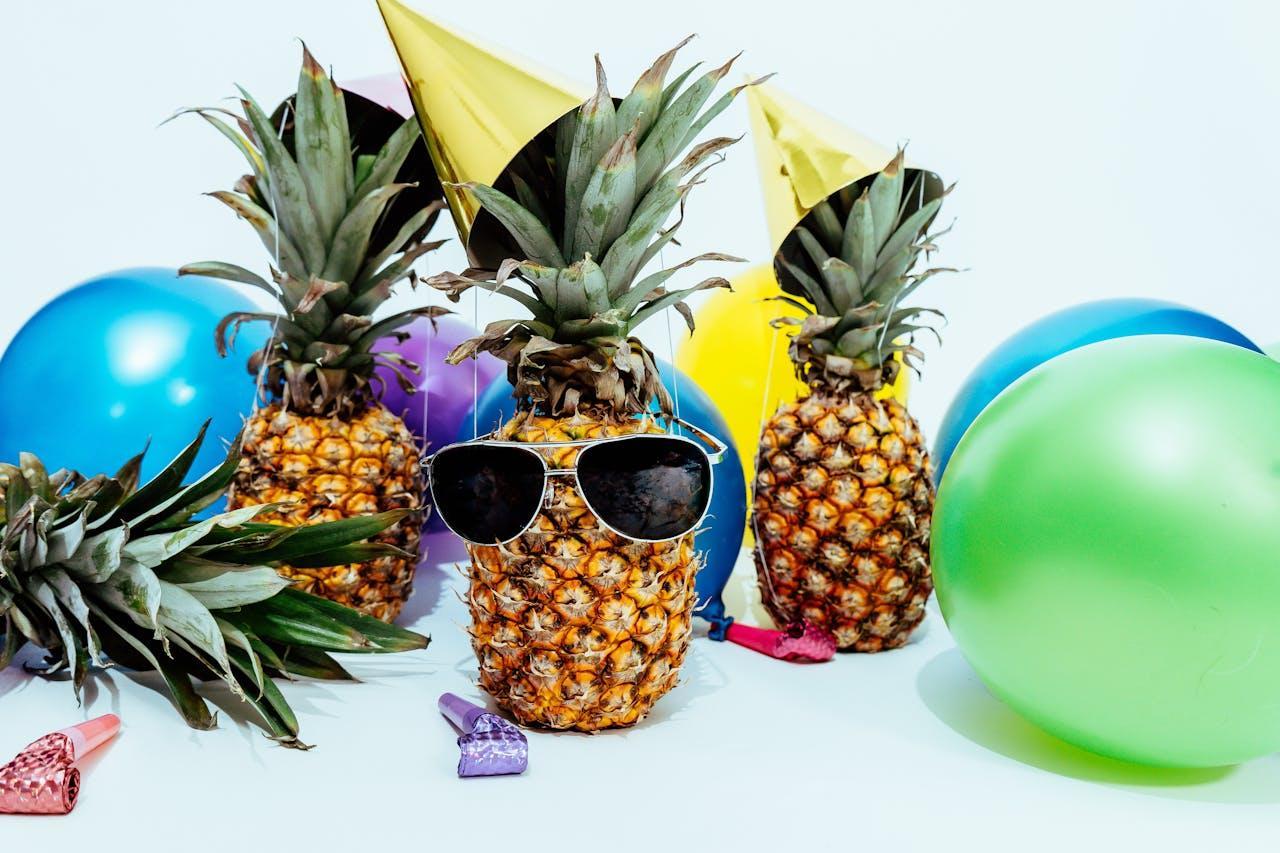 pineapples, balloons, and party hats for 18th year old birthday party