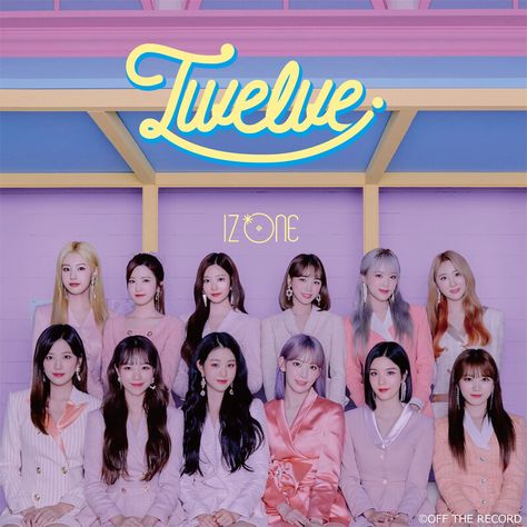 This contains an image of IZ*ONE's  members of twice pose for a photo in front of a neon sign that reads 'izone '