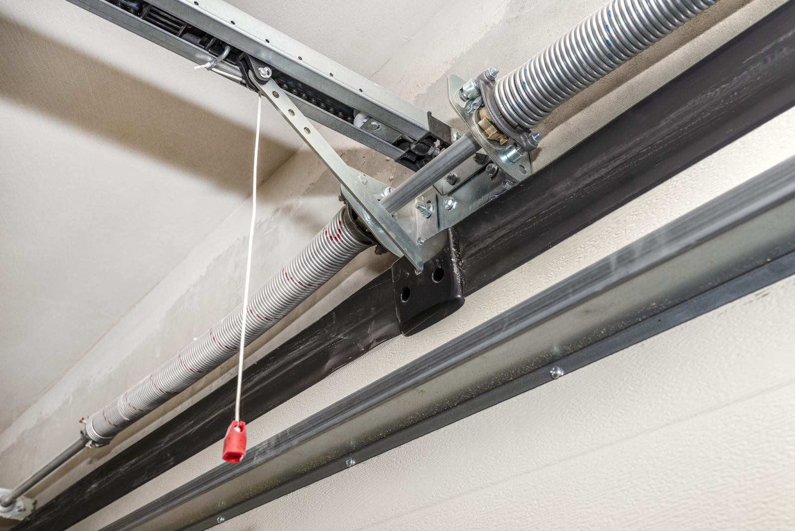 how to check garage door spring tension