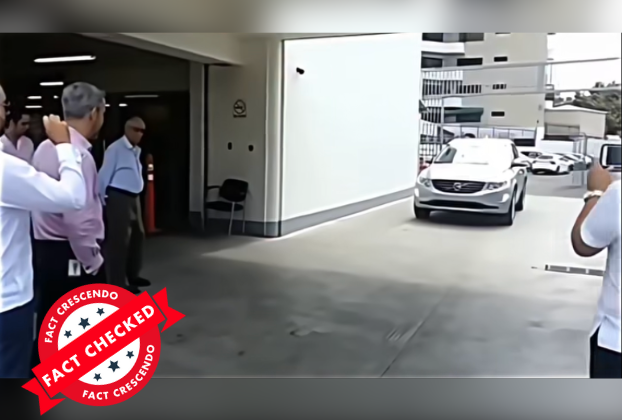 A person standing in front of a car

Description automatically generated