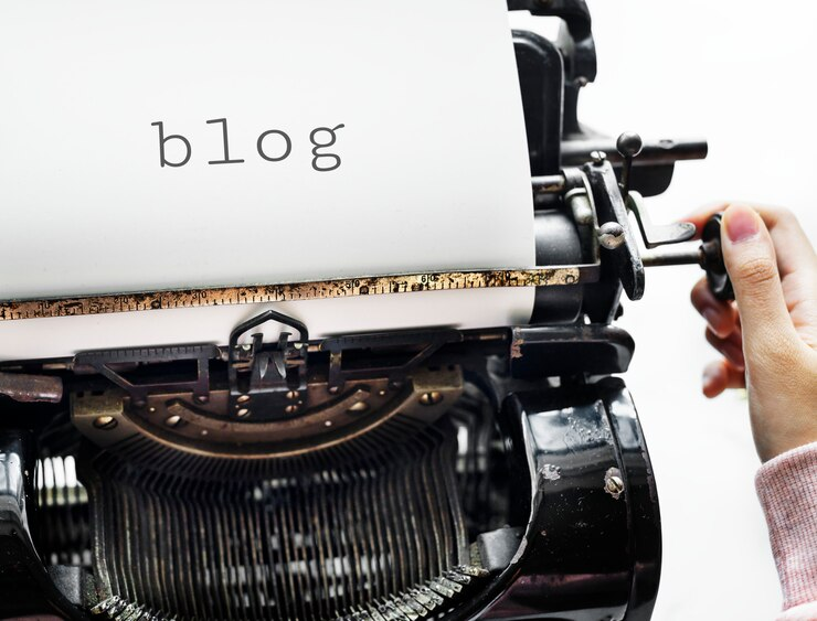 The word blog written on a paper coming out of a typewriter