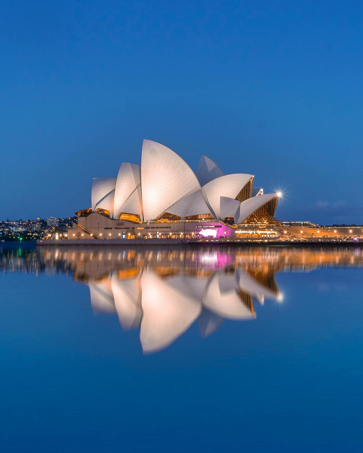 Sydney Opera House illuminated at night, symbolising international shipping to Australia