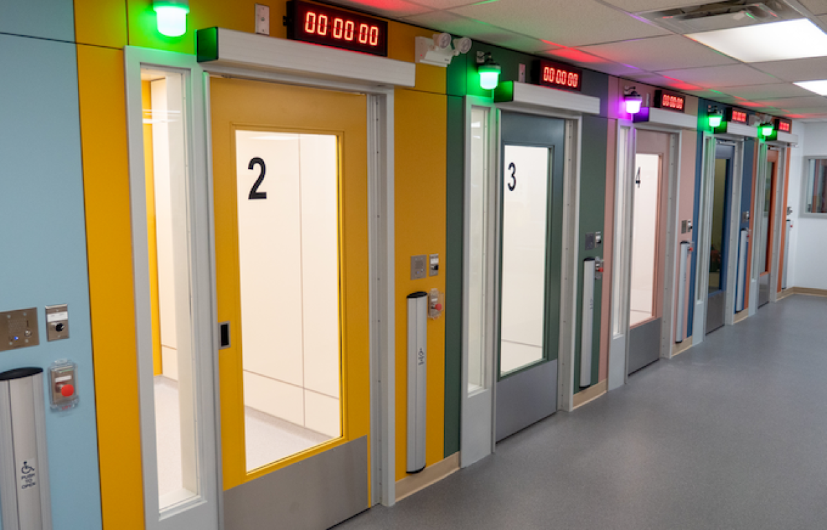 A row of doors with timers containing supervised inhalation rooms