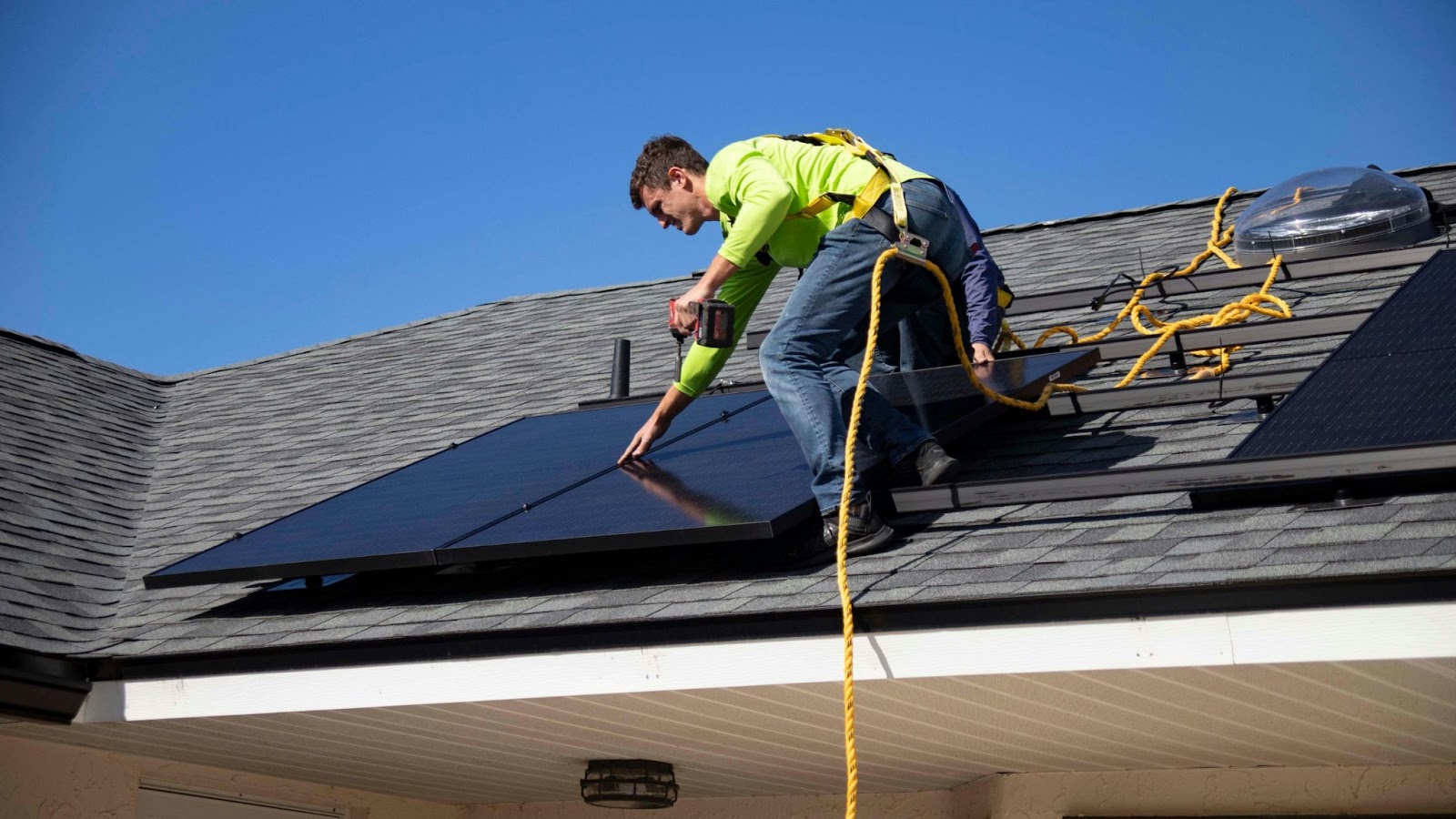 a man showing how to install solar panels