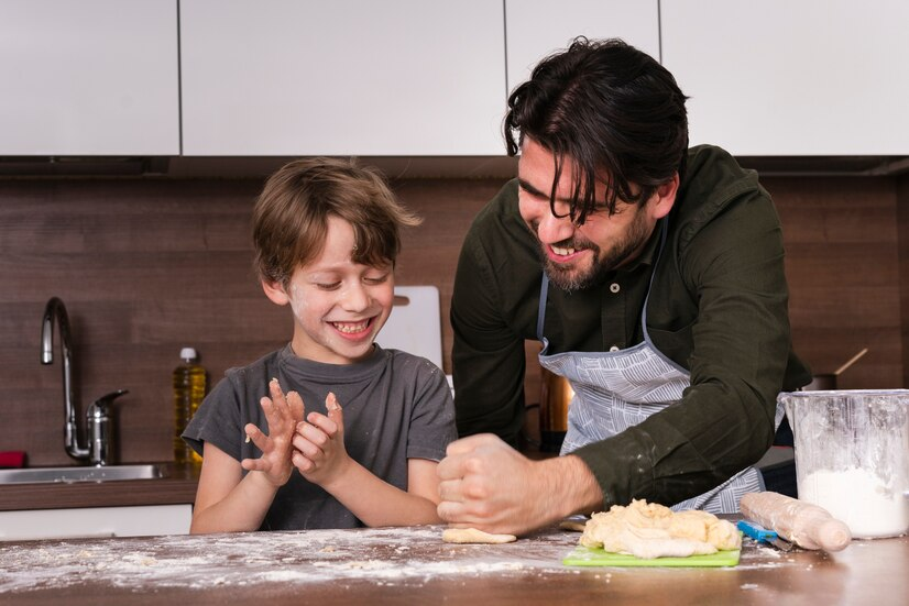 an adult and child cooking