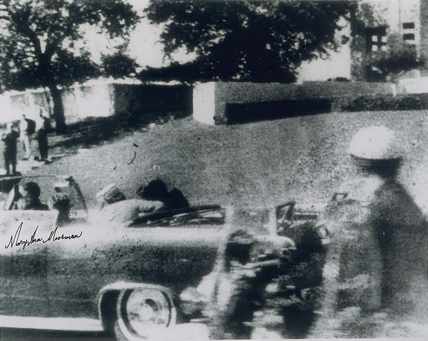 Polaroid taken by witness to JFK's assassination, Mary Ann Moorman. The photo shows the split-second after the President was struck going through Dealey. Her photo captures the grassy knoll, a point of contentious debate in many Kennedy assassination theories.