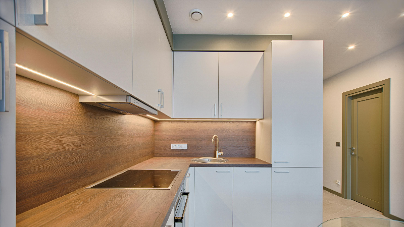 a bright kitchen with under lighting 