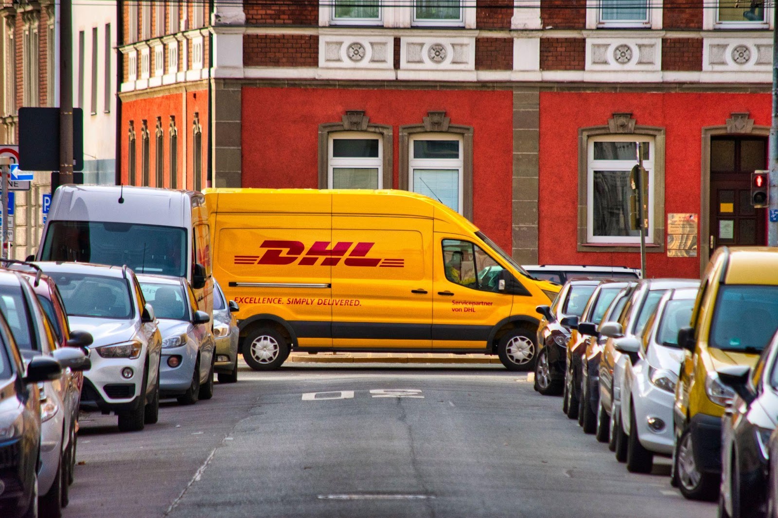 DHL van rolling down the street