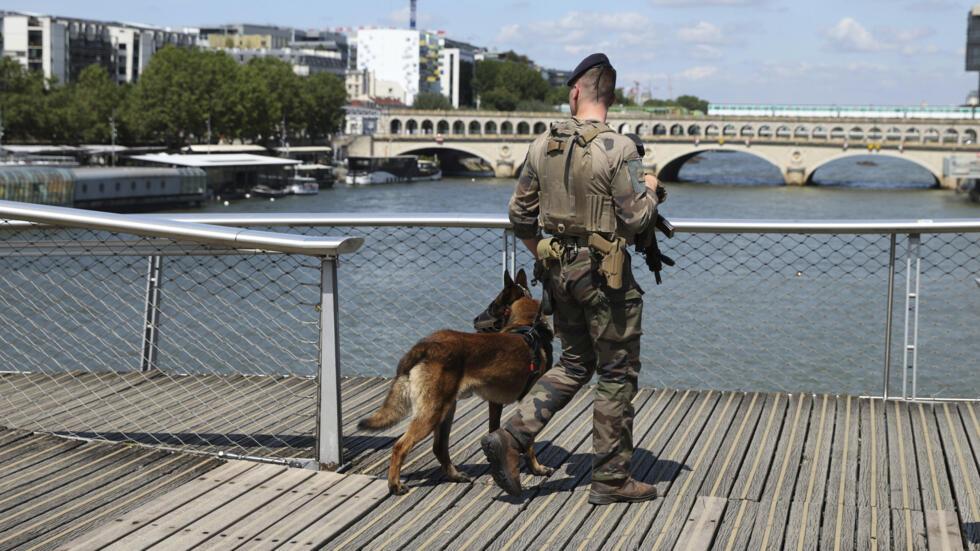 A soldier patrols on a footbridge over the Seine river, Wednesday, July 17, 2024 in Paris.