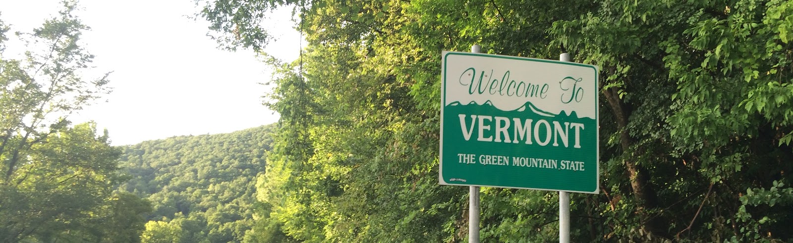 Cycling Burke Mountain - Welcome to Vermont sign