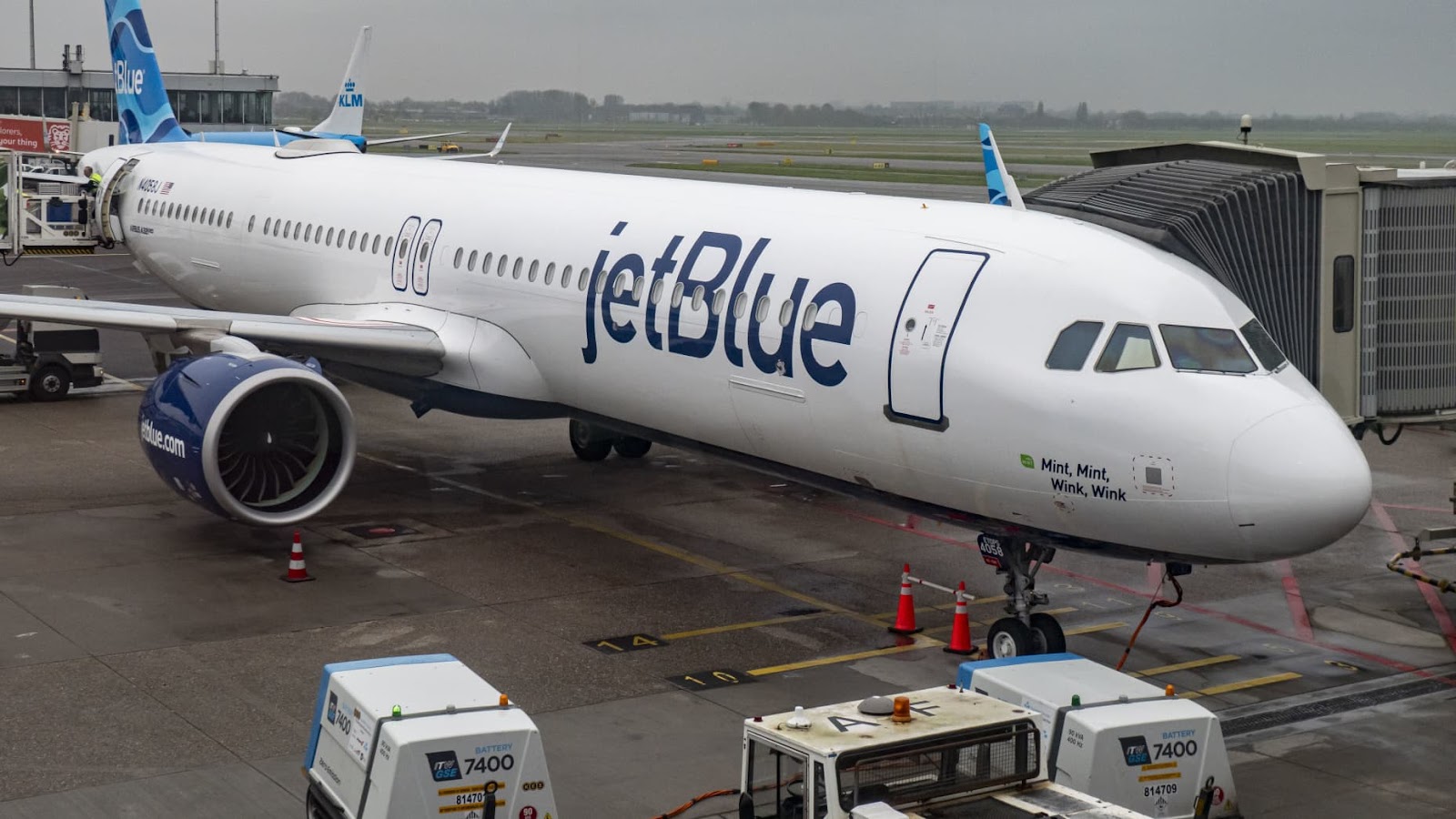 JetBlue Airbus A321neo aircraft flying, landing and taxiing at Polderbaan runway in Amsterdam Schiphol International Airport AMS EHAM in the Netherlands. The narrow body airplane is utilized in transatlantic flights with increased fuel efficiency and range comparing to the predecessors A321ceo. The A321 NEO passenger plane arrived as flight B632 from Boston and departed to New York JFK in the USA.  The single aisle airliner has the tail number registration N4048J, is named " Allow Me To Mintroduce Myse