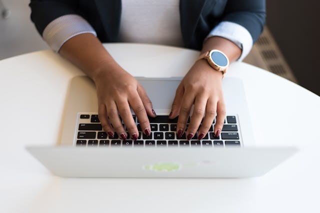 Person typing on computer