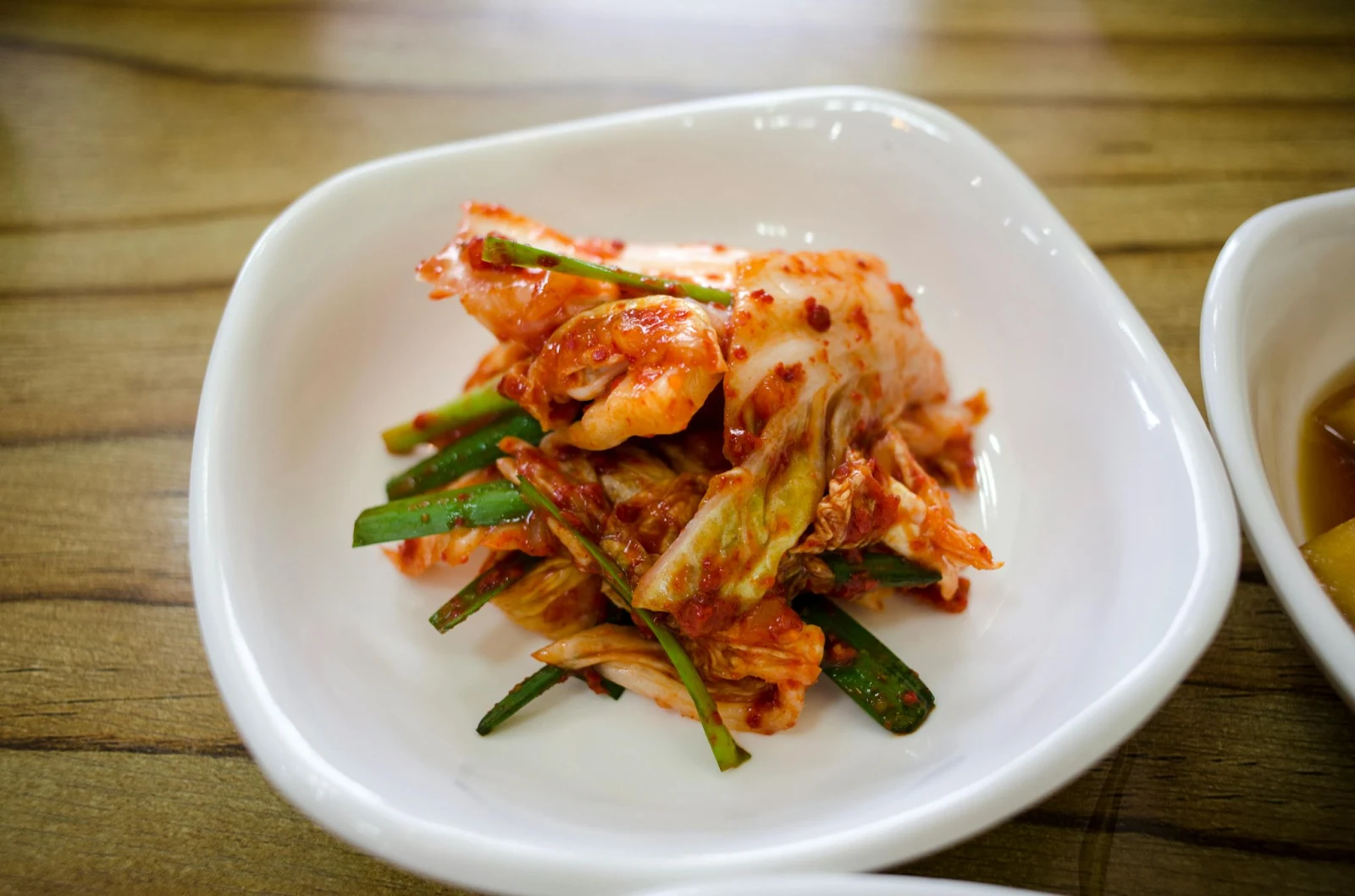 korean cuisine kimchi in a bowl. cabbage and green vegetables looking appetizing 