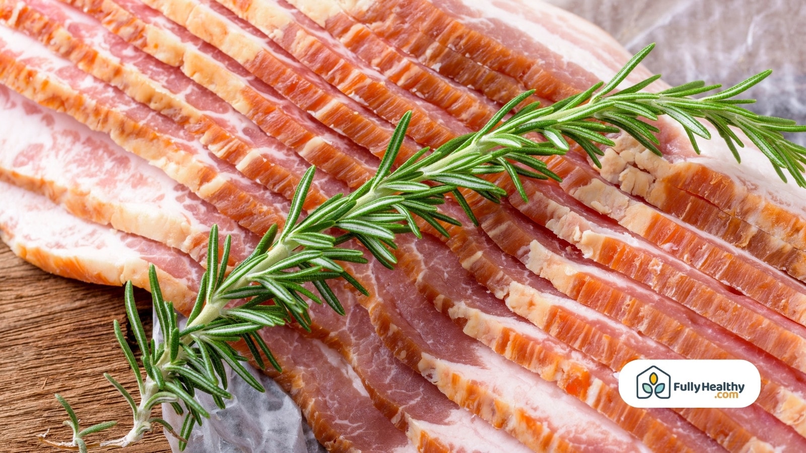 Freshly sliced bacon with rosemary on butcher paper