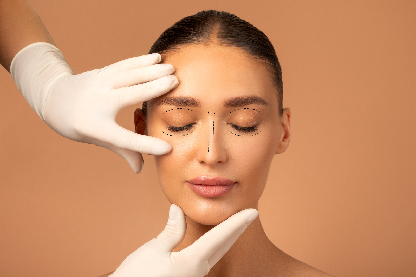 A woman with closed eyes is examined by a plastic surgeon wearing white gloves, assessing her face for a blepharoplasty procedure.