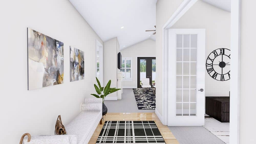 The foyer flows into the home office and open living space.