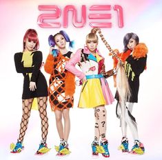 This contain 2NE1 in costumes standing next to each other with the word fens on them