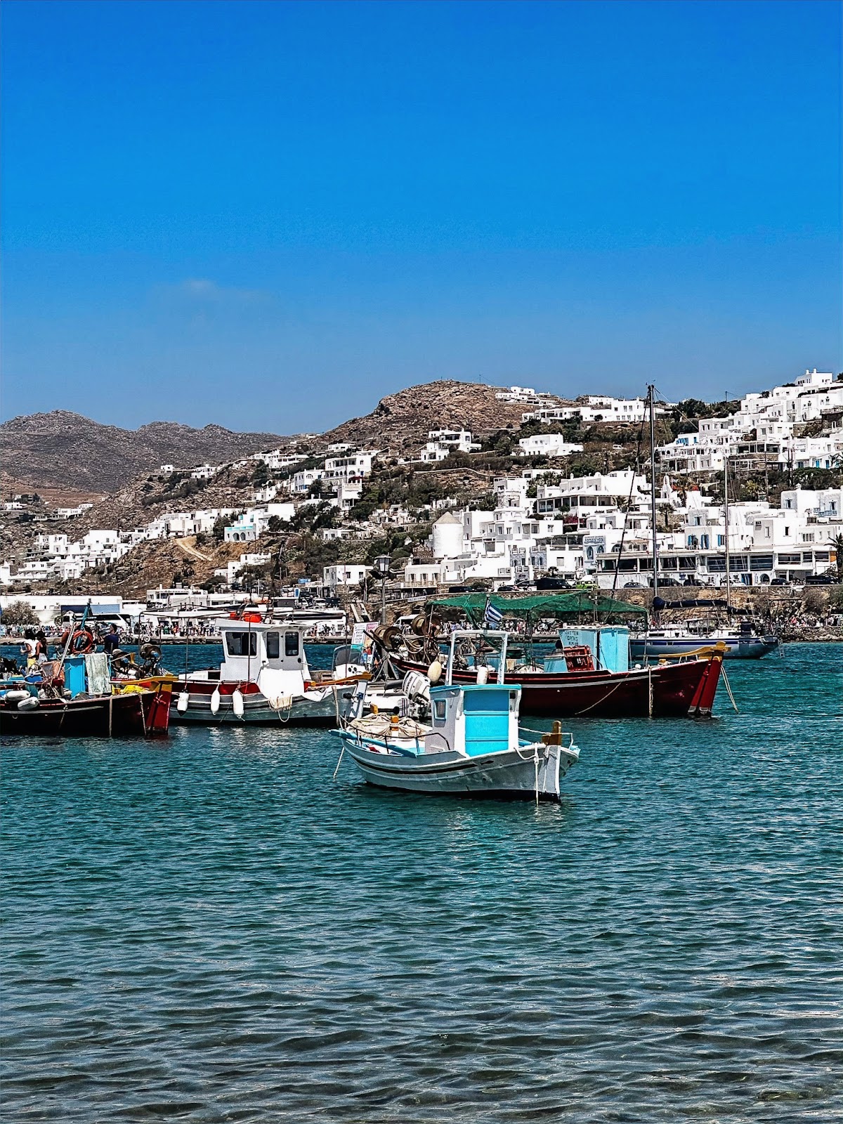 Mykonos, on the water viewing many boats int he harbor