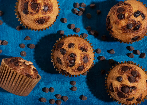 a group of muffins with chocolate chips